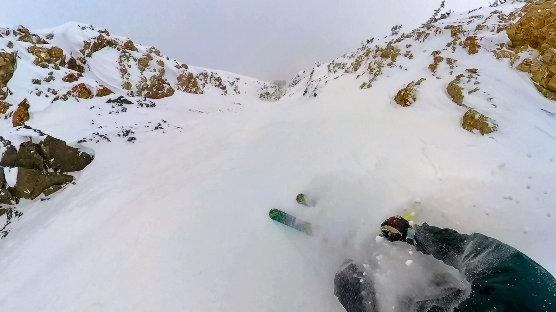 skier getting face shot in deep snow at Alta Ski Area Utah